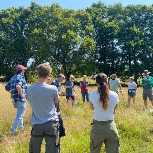 Group watching soil testing